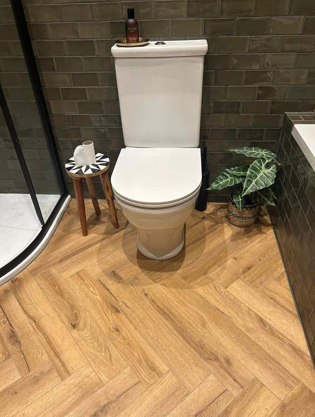 Greyscale tiled shower area by Plumb Yorkshire.