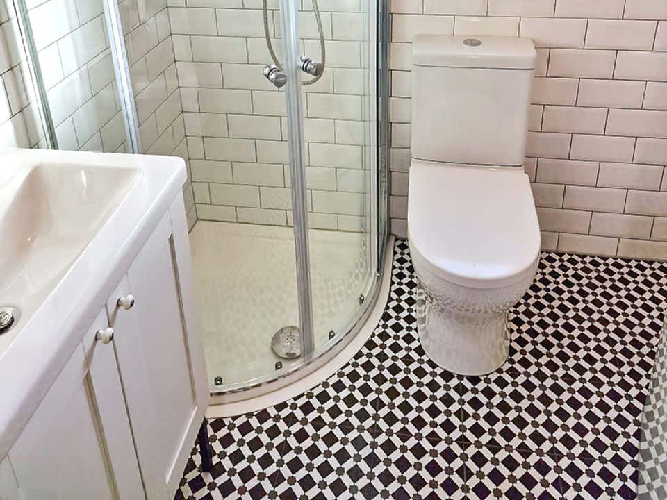 Luxury bathroom with corner shower installed by Plumb Yorkshire Ltd.