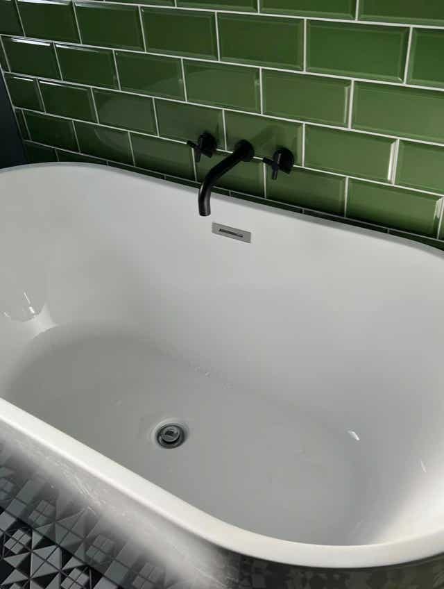 Herringbone floor pattern bathroom by Plumb Yorkshire.