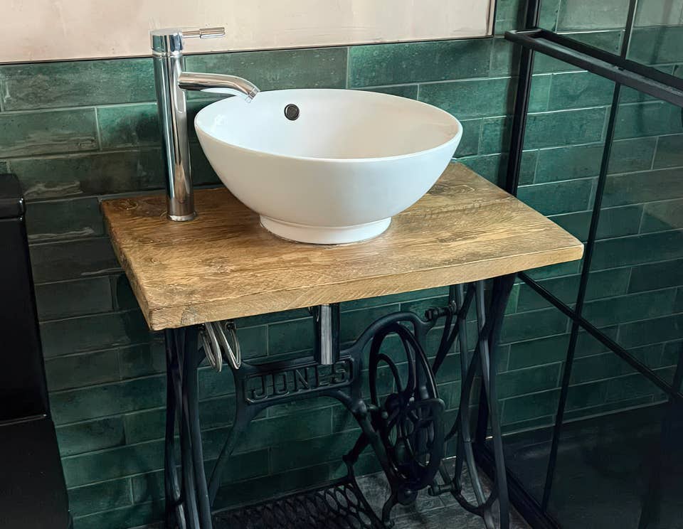 Image of an old spinning wheel table upcycled into sink unit