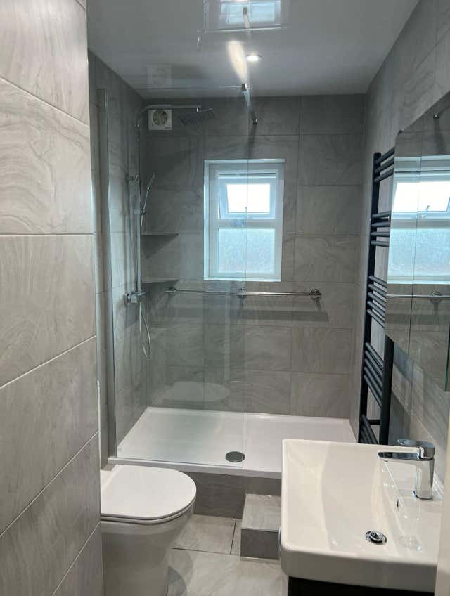 Modern kitchen black white patterned flooring by Plumb Yorkshire.