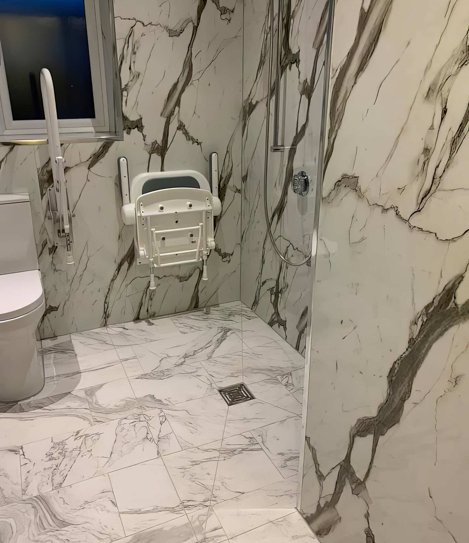 Image of a modern wet wall panel design in a mobility bathroom devised by Plumb Yorkshire Ltd.