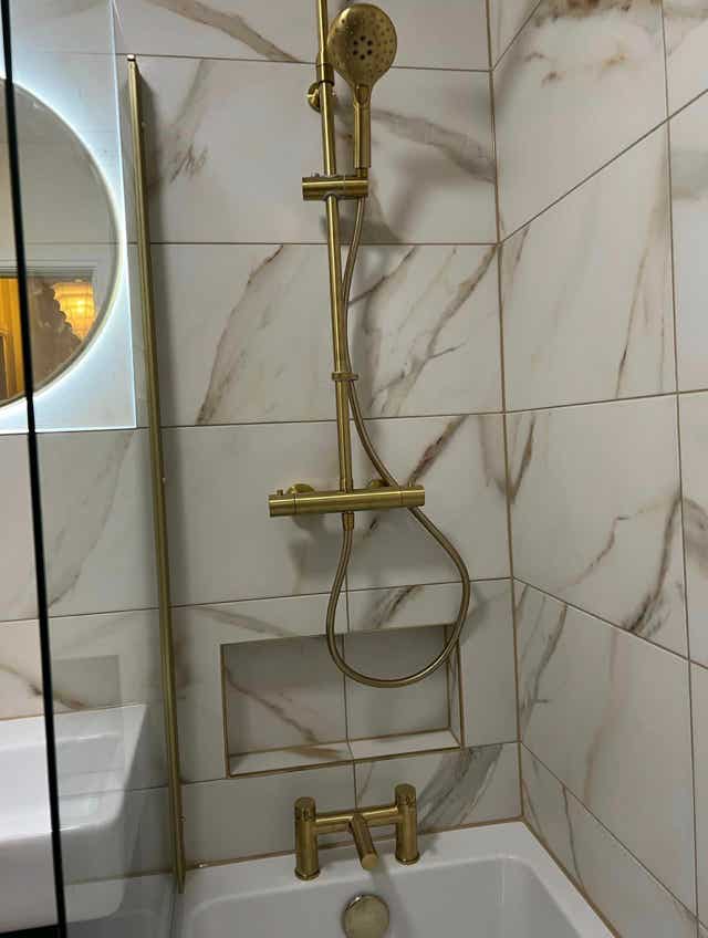 Luxury brushed gold shower unit by Plumb Yorkshire.