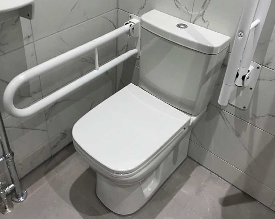 Image of toilet with mobility fittings in a mobility bathroom crafted by Plumb Yorkshire Ltd.