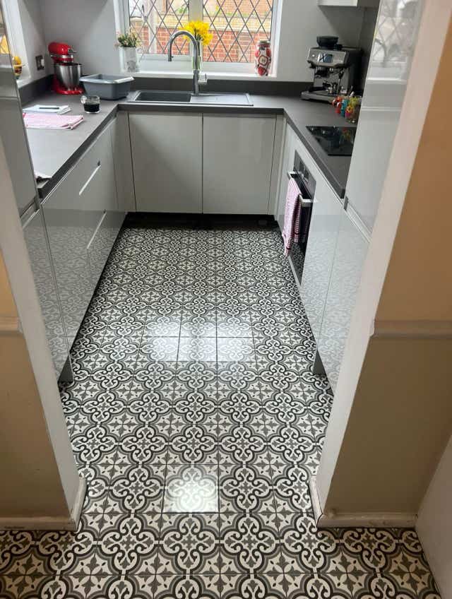 Modern kitchen black white patterned flooring by Plumb Yorkshire.