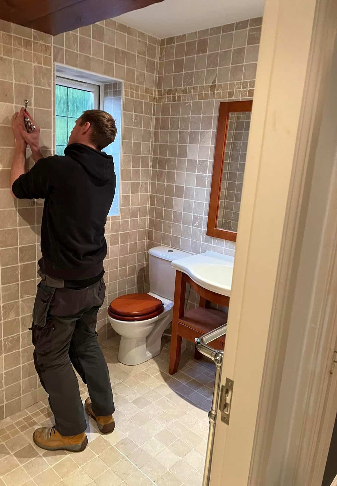 Image of Plumb Yorkshire Ltd. team member adjusting fittings.