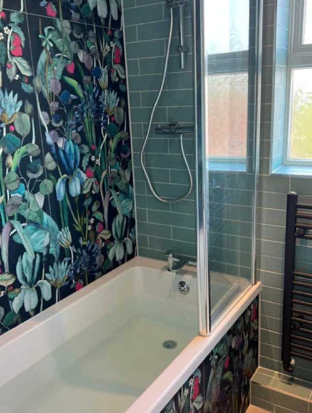 Floral tiled bathtub elegance by Plumb Yorkshire.