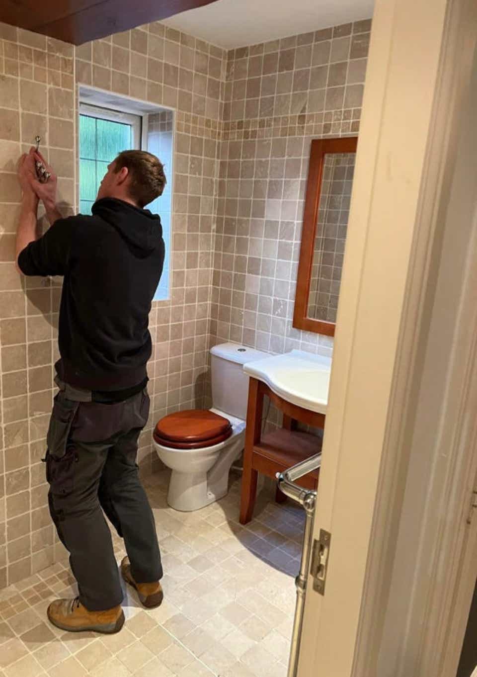 Image of Plumb Yorkshire Ltd. team member adjusting fittings.