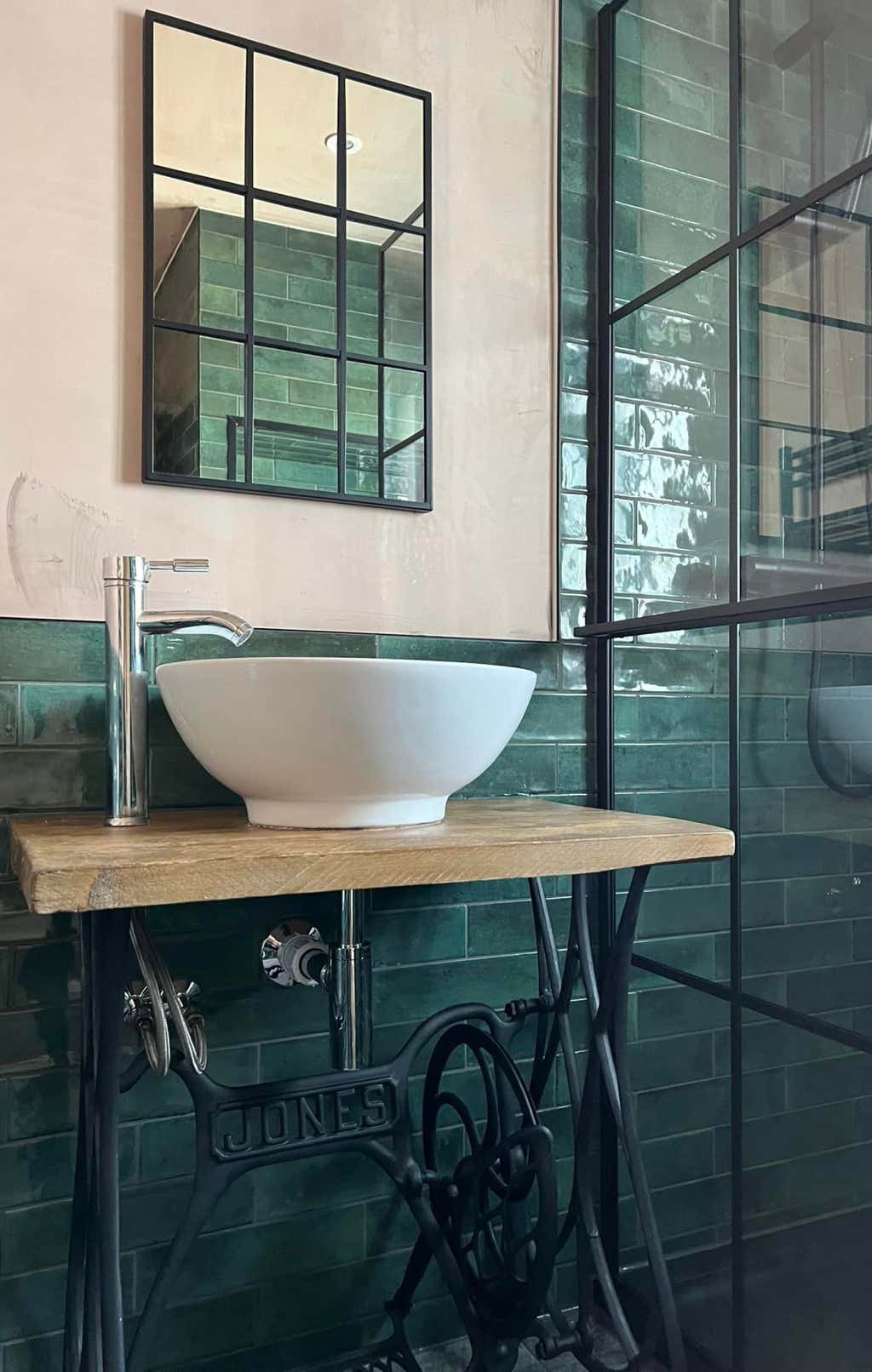 Old spinning wheel table upcycled as sink unit by Plumb Yorkshire Ltd.