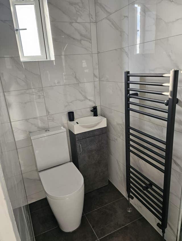 Contemporary bathroom radiator by Plumb Yorkshire.